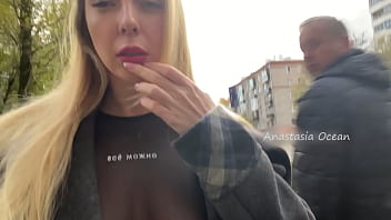 A chick showcases her bra-stuffers while ambling in public in the city